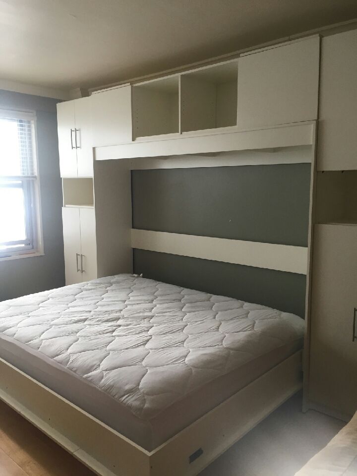 Queen size Wall Bed with custom lights in the bookcases with drawers