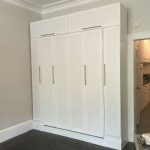 Queen size Murphy bed with custom hutch + bookcases on podium with raised panel