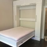 Queen size Murphy bed with custom hutch + bookcases on podium with raised panelsQueen size Murphy bed with custom hutch + bookcases on podium with raised panels - opened