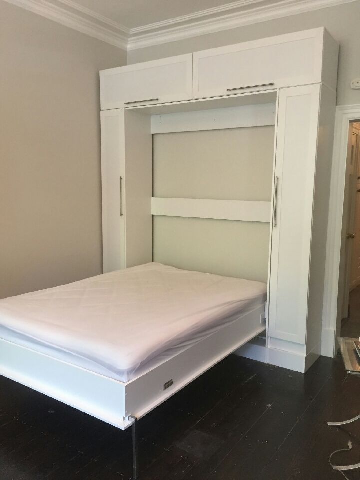 Queen size Murphy bed with custom hutch + bookcases on podium with raised panelsQueen size Murphy bed with custom hutch + bookcases on podium with raised panels - opened