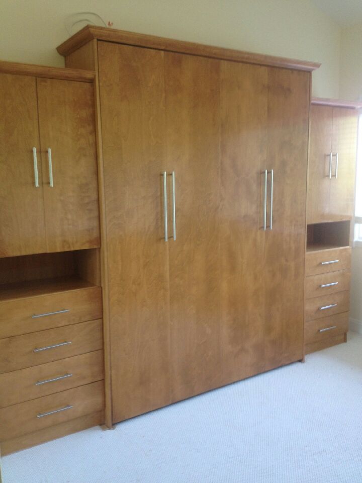 Queen size wood veneer custom cabinets with drawers and doors crown molding with veneer staying in a light cherry