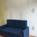 Vertical Queen Size Murphy Bed with Murphy Sofa in white - closed.